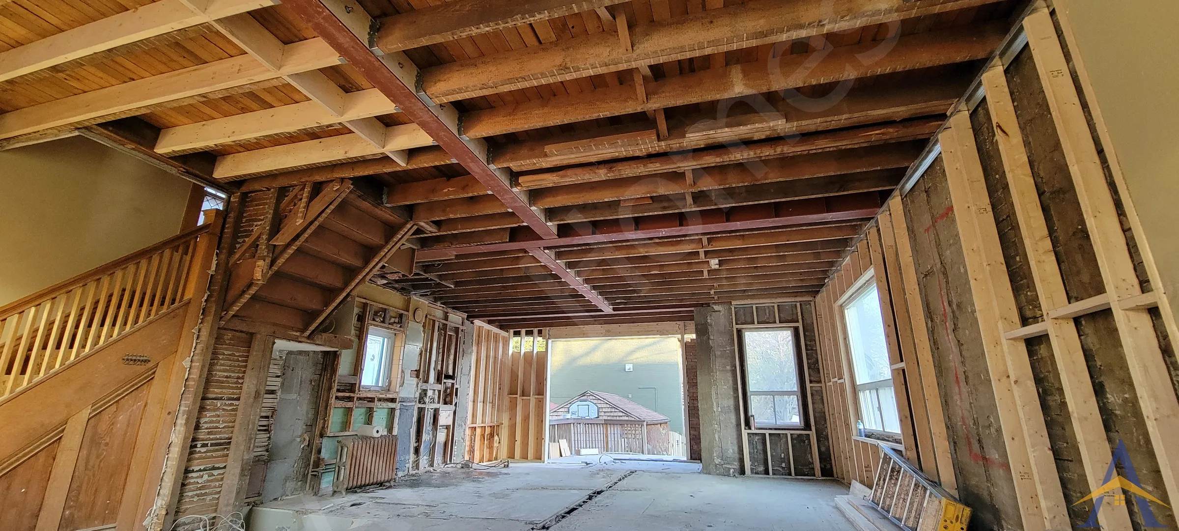 Open main floor with new steel beam during a load-bearing wall removal in Toronto